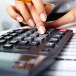 Girl doing calculations on a calculator