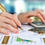 Girl counts on a calculator