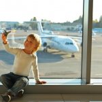 Boy on the background of an airplane